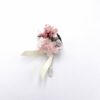Boutonnière en fleurs stabilisées Tourmaline pour le marié